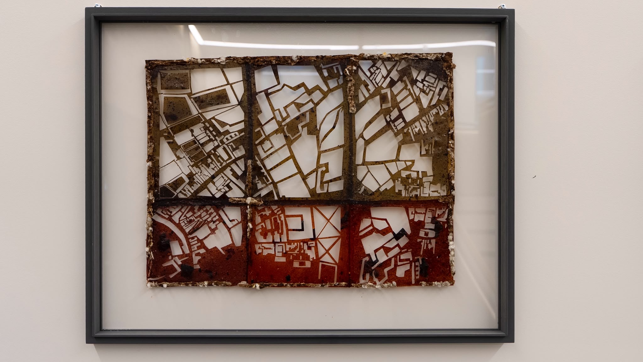 Detail view of a Layers of Passage framed panel, showing translucent cut surfaces and light